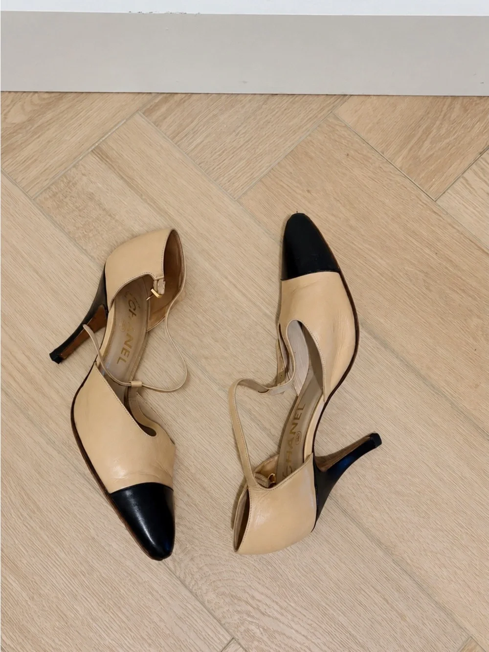 CHANEL Beige and Black Cap-Toe Slingback Heels